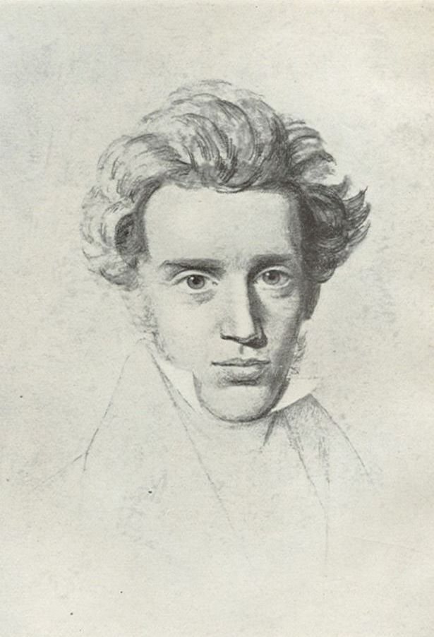 A pencil sketch of the young Søren Kierkegaard, his hair swept up and back, looking straight out with large dark eyes